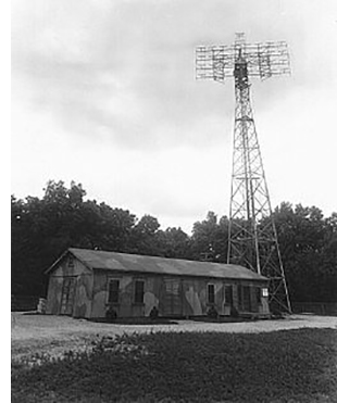 A building with a radar tower next to it